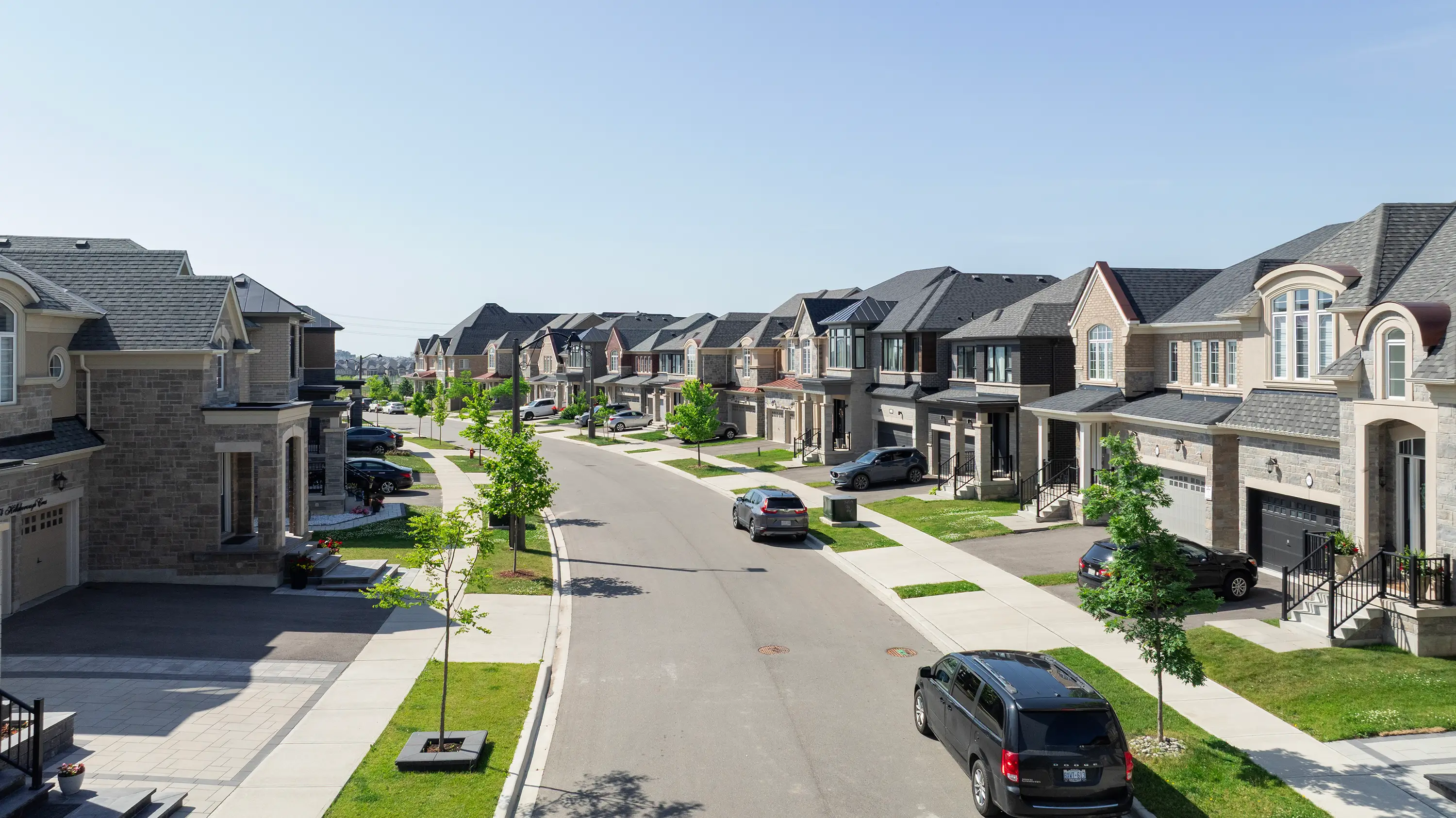 Residential streetscape in Rosehaven Homes’ Ivy Rouge community marketing photograph