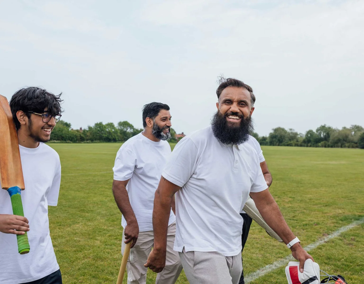 Builder lifestyle photograph of friends enjoying a cricket game