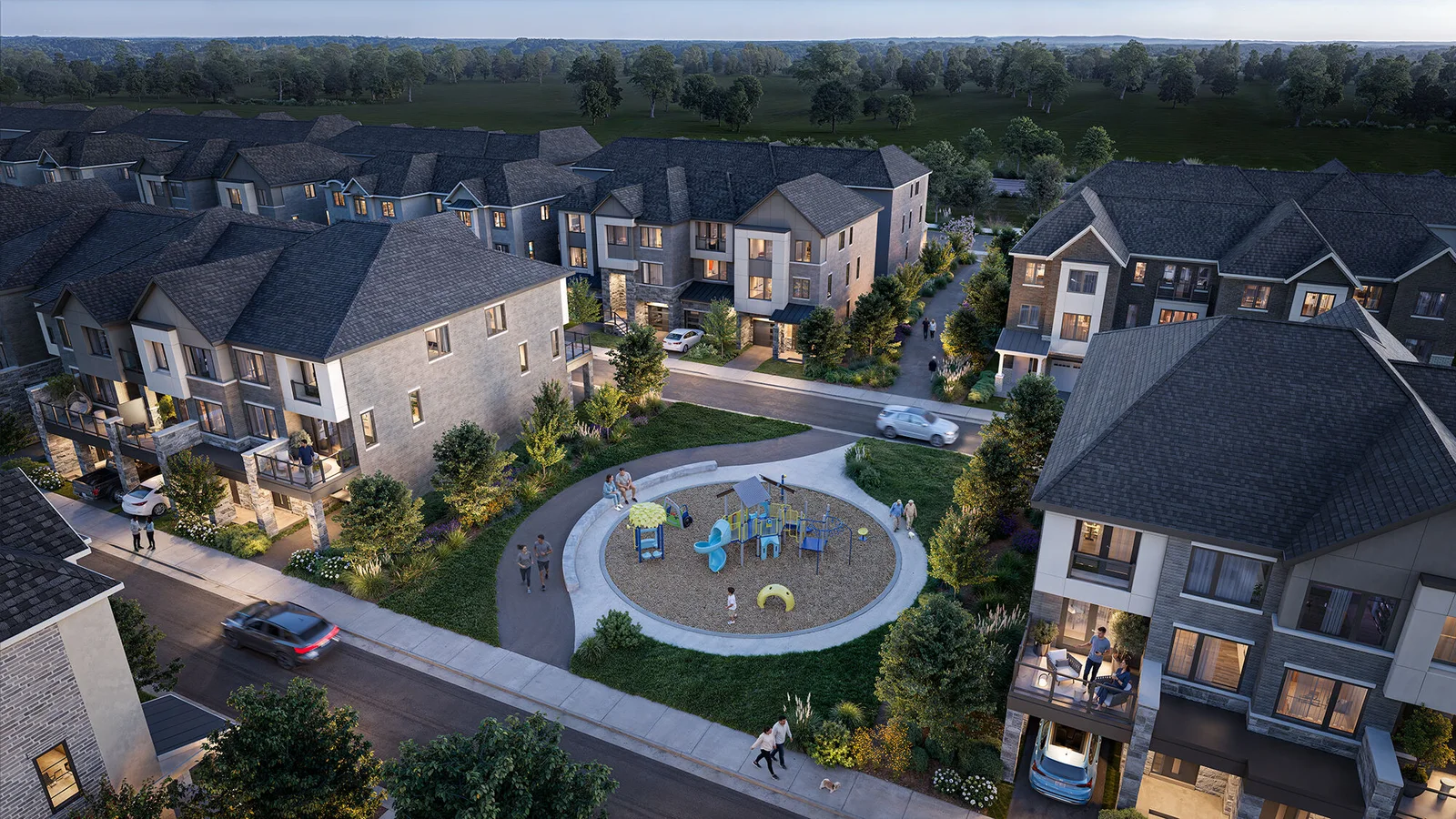 Aerial dusk rendering of a townhome neighbourhood around a circular playground, lush landscaping and neighbours strolling.